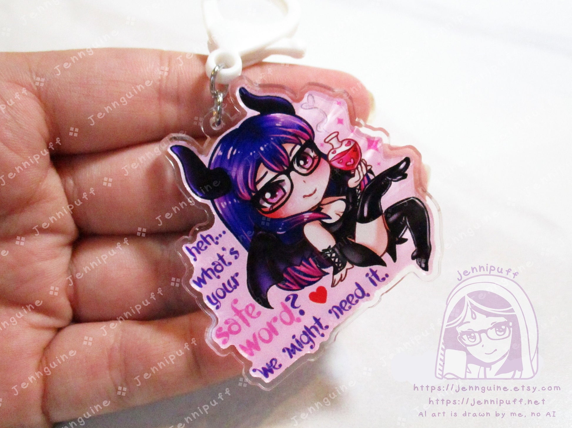 Acrylic double sided keychain with a chibi pink and purple succubus holding a love potion. This is the front of the keychain. Text says: Heh... what's your safe word? We might need it."
