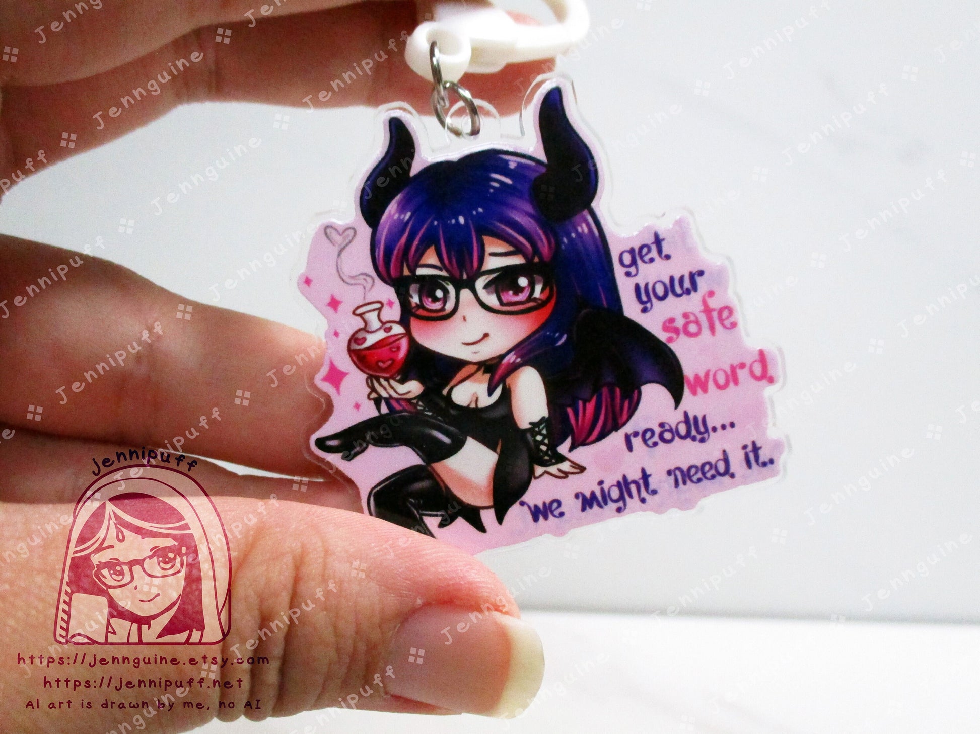 Acrylic double sided keychain with a chibi pink and purple succubus holding a love potion. This is the back of the keychain. Text says: Get your safe word ready... We might need it."
