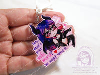 Acrylic double sided keychain with a chibi pink and purple succubus holding a love potion. This is the front of the keychain. Text says: Heh... what&#39;s your safe word? We might need it.&quot;