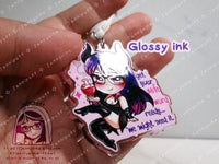 Acrylic double sided keychain with a chibi pink and purple succubus holding a love potion. This photo shows the glossy ink on the back side of the charm.